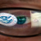 An analyst at the DHS’ cyber defense facility in Idaho Falls, Idaho who is supposedly staring at a DHS emblem superimposed on a circuit board graphic for some reason.